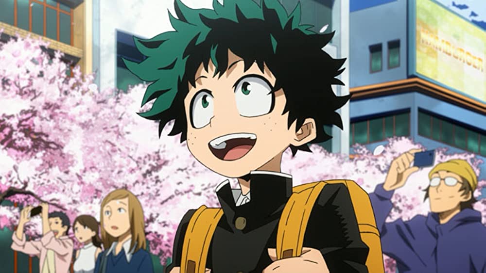 Izuku Midoriya from "My Hero Academia" (2016) looks in wonder at something in front of him. 