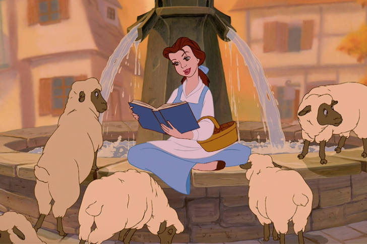 Belle sits on a fountain reading a book to sheep. 