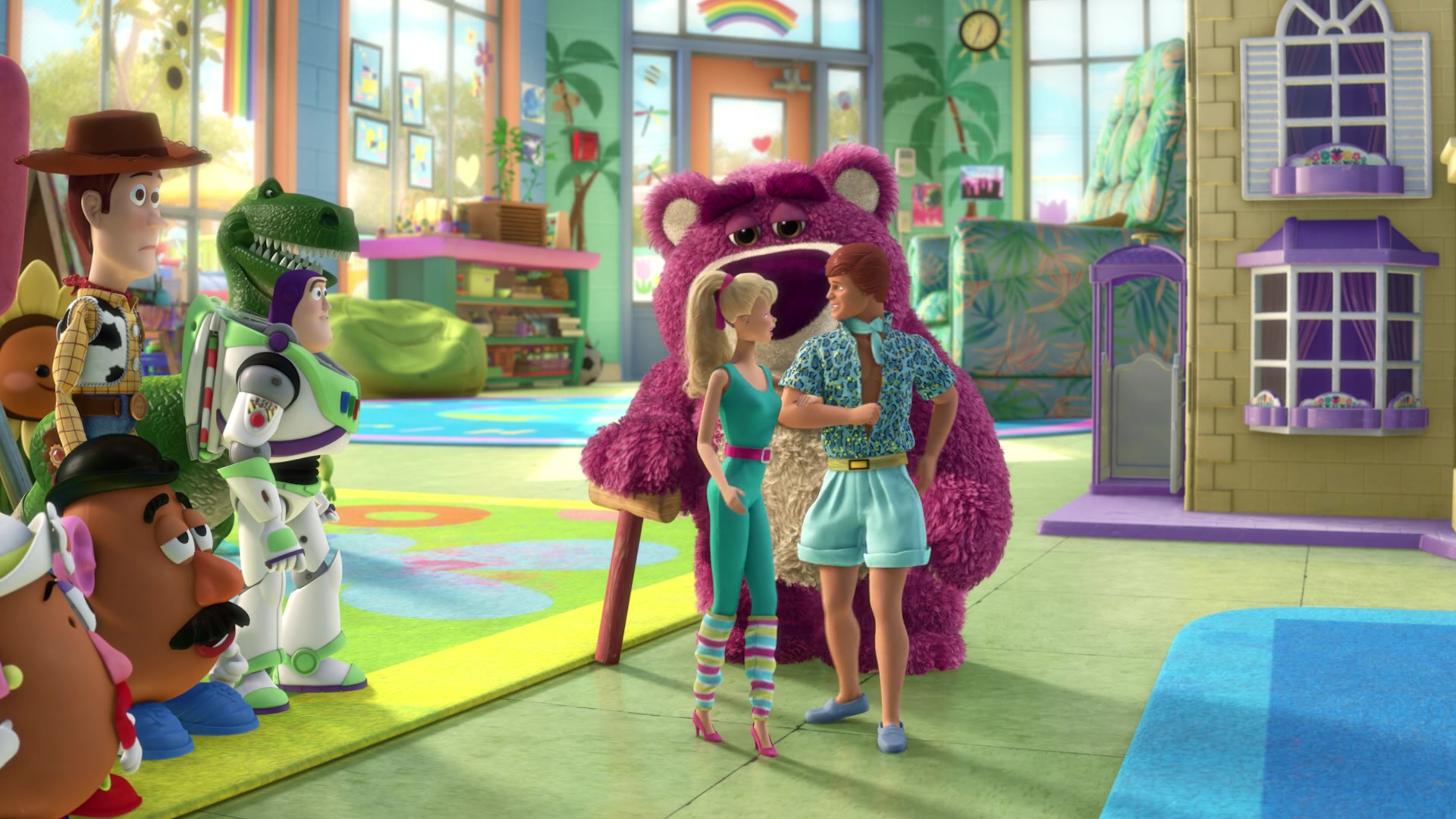 Barbie and Ken linking arms as the rest of the toys watch on in Toy Story 3.