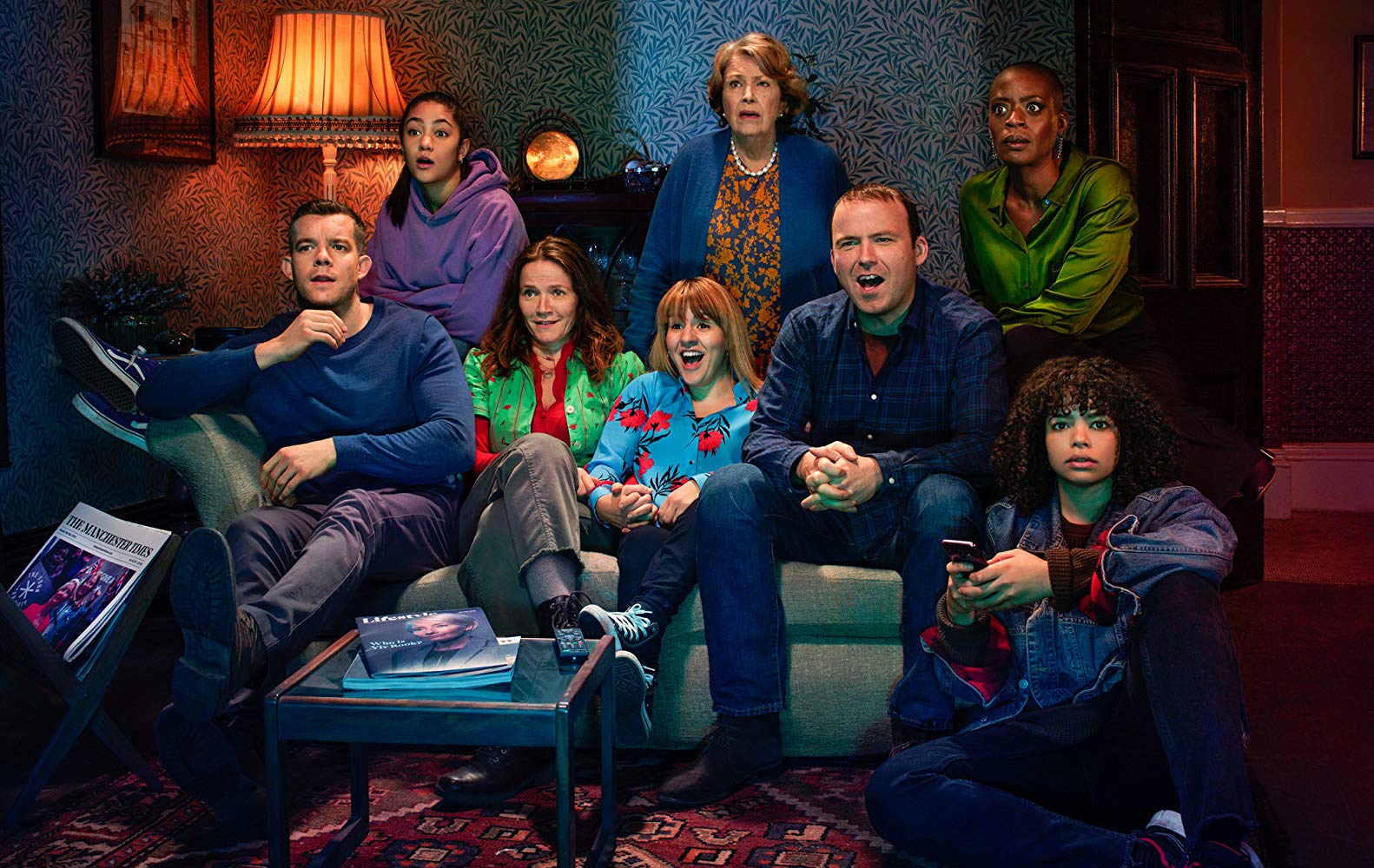 Promotional photo for Years and Years: the Lyons family sitting on a couch and watching TV