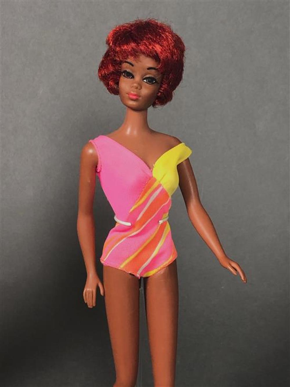 The first Christie doll, wearing a pink and yellow swimsuit.