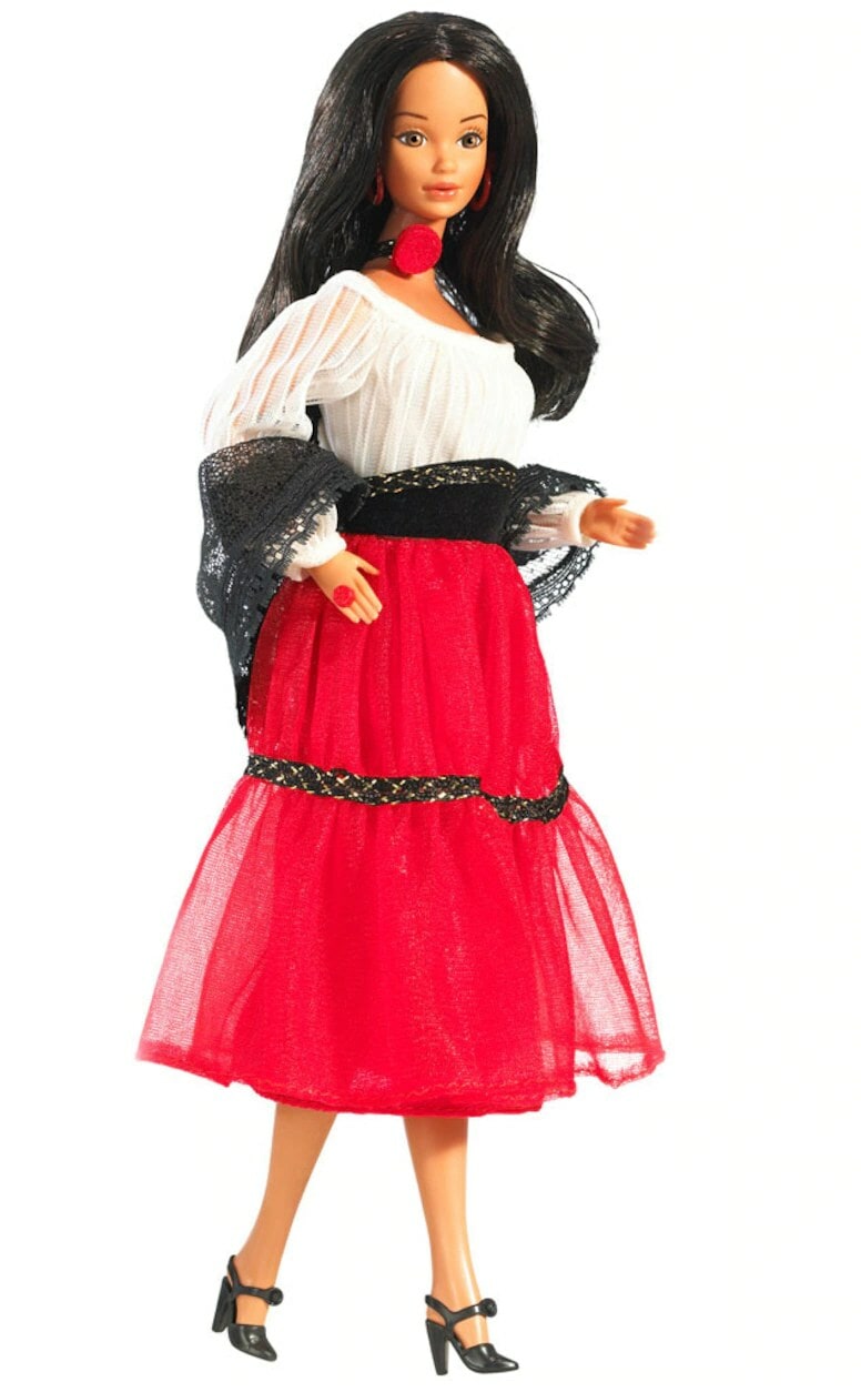 The first Hispanic Barbie, with long wavy black hair and a red and white dress.