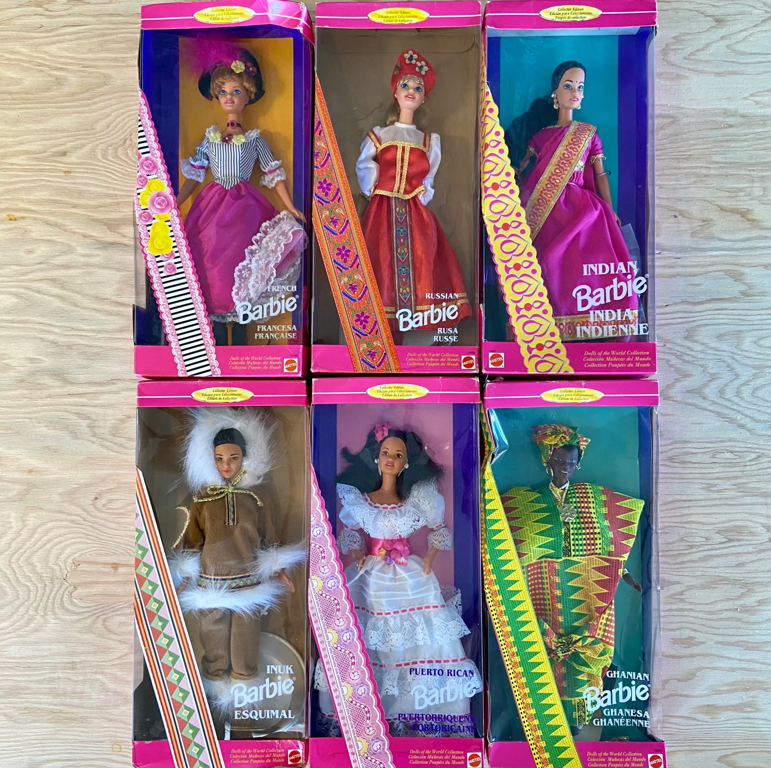 Six Barbie Dolls of the World: French Barbie, Russian Barbie, Indian Barbie, Inuit Barbie, Puerto Rican Barbie, and Ghanian Barbie.