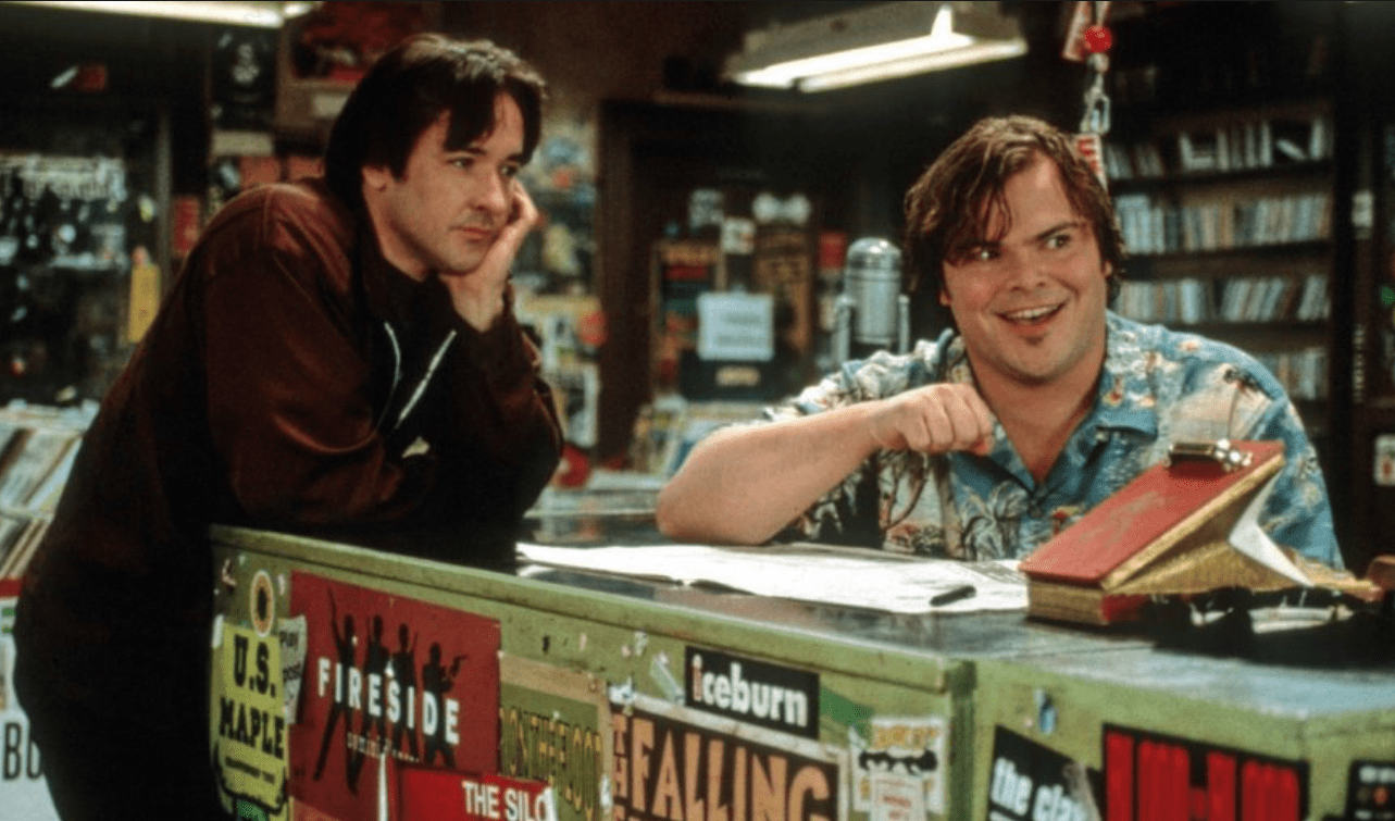 Rob and his friend Barry at the record store in the original adaptation. Frears, Steven. High Fidelity. 2000.