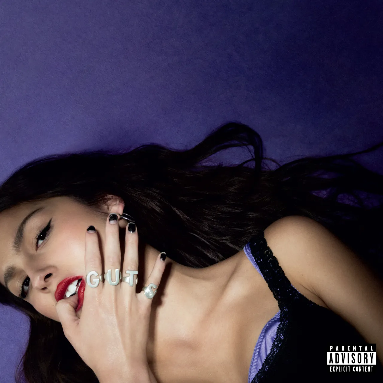Olivia Rodrigo on the "GUTS" album cover.