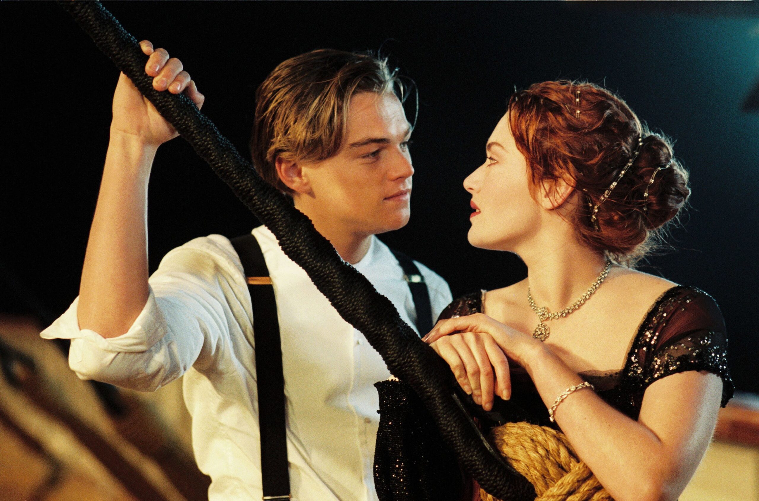 Shot from Titanic (1997), one of the most famous tragic romances ever: Jack and Rose look into each other's eyes. 