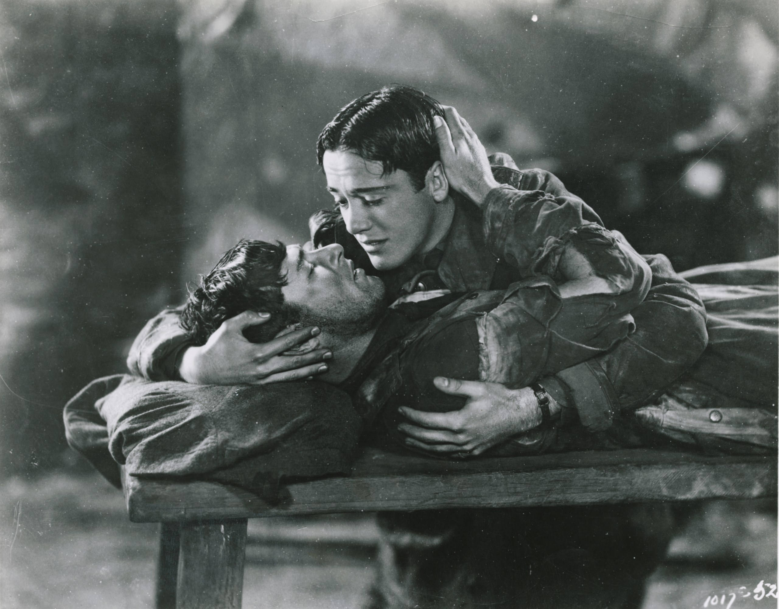Charles (Buddy) Rogers holds and comforts Richard Arlen on his deathbed in a scene from the movie Wings. (Photo by John Springer Collection/CORBIS/Corbis via Getty Images). 

A Pre-Production code film that showed the first official gay kiss. Wellman, William and d d'Arrast, Harry, Dirs. Wings. 1927