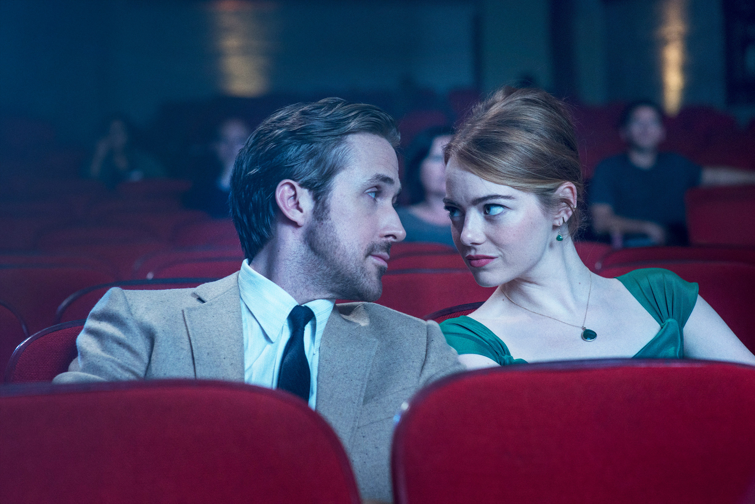 Shot from La La Land: Mia and Seb about to kiss while at the movies. 