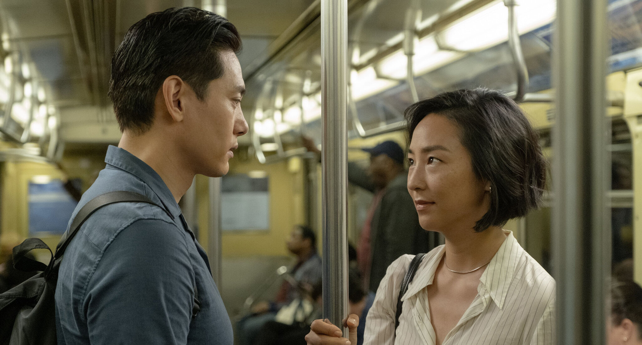 Shot from Past Lives: Nora and Hae Song look at each other while on the subway. 