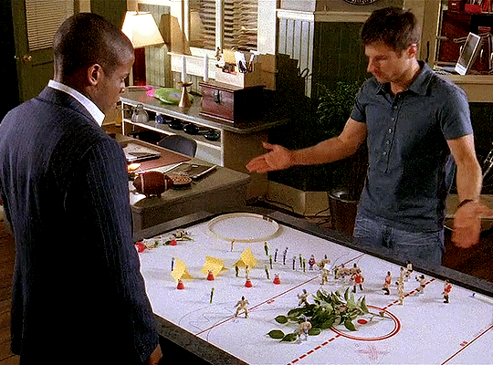 Shawn displays his recreation battlefield to Gus. 