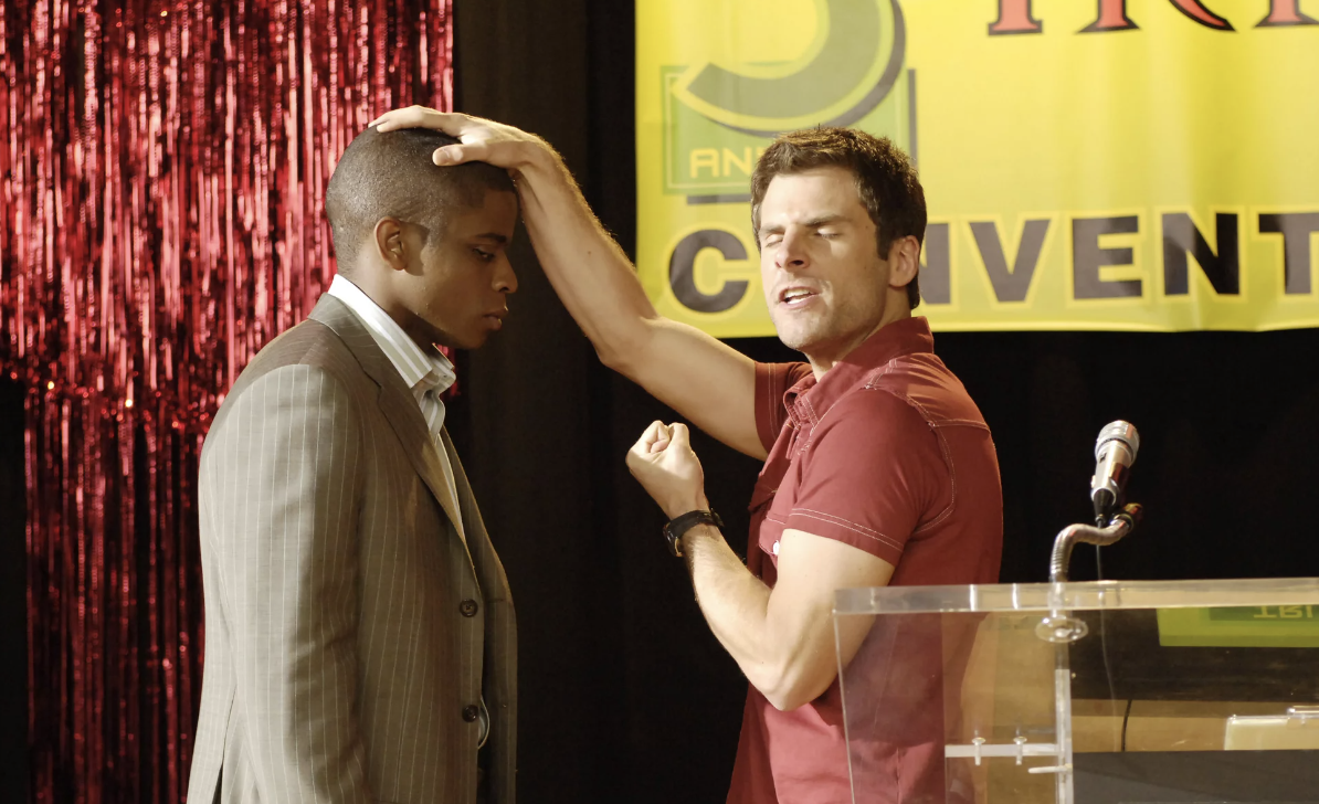 Shawn puts a hand on Gus's head and pretends to have a psychic vision. 