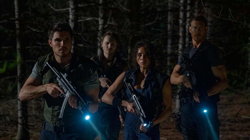 Robbie Amell, Chad Rook, Hannah John-Kamen, and Tom Hopper in 'Resident Evil: Welcome to Raccoon City' (2021). Roberts, Johannes. 'Resident Evil: Welcome to Racoon City', 2021.