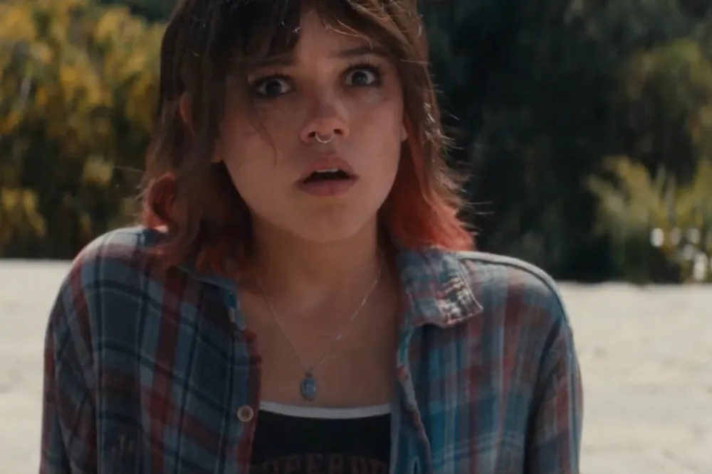Ridley (Jenna Ortega) stares at the camera, shocked. Scharfman, Alex. Death of a Unicorn. 2025.