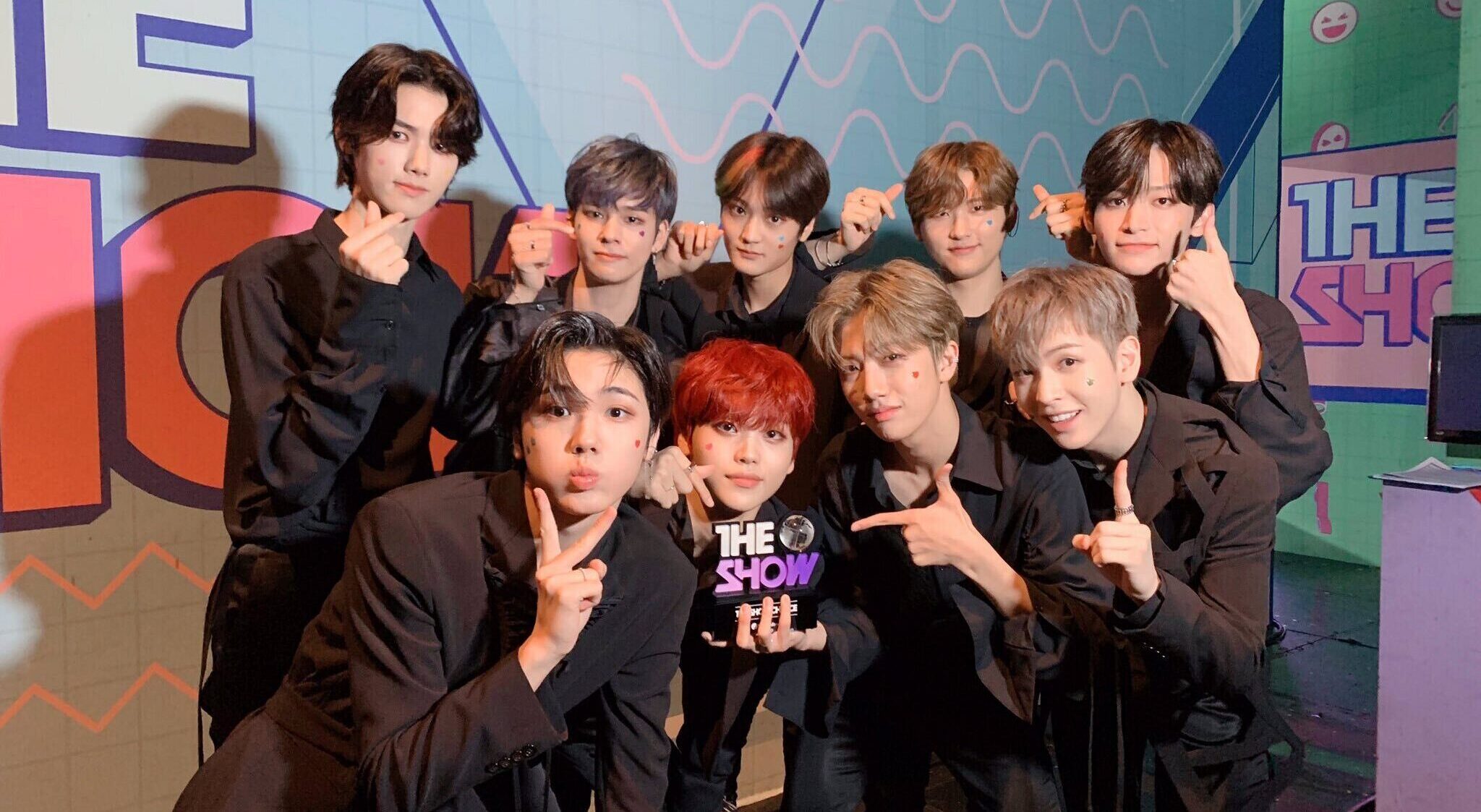 Cravity posing with their trophy on SBS The Show after winning 1st place for their song "Flame" on September 1, 2020.