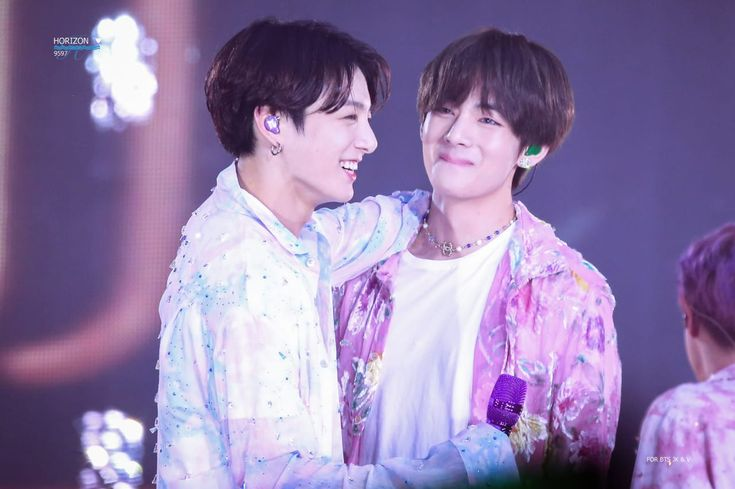 BTS's V and Jungkook hug each other on tour.