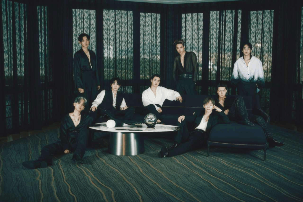 EXO members pose wearing dark, loose clothing.
