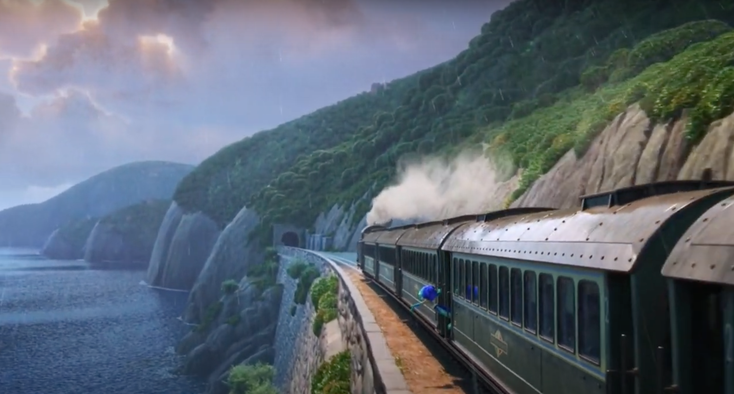 Luca hangs off the side of a train traveling cliffside toward Genova. His arms are spread wide and he is gazing into the sky in sea monster form.
