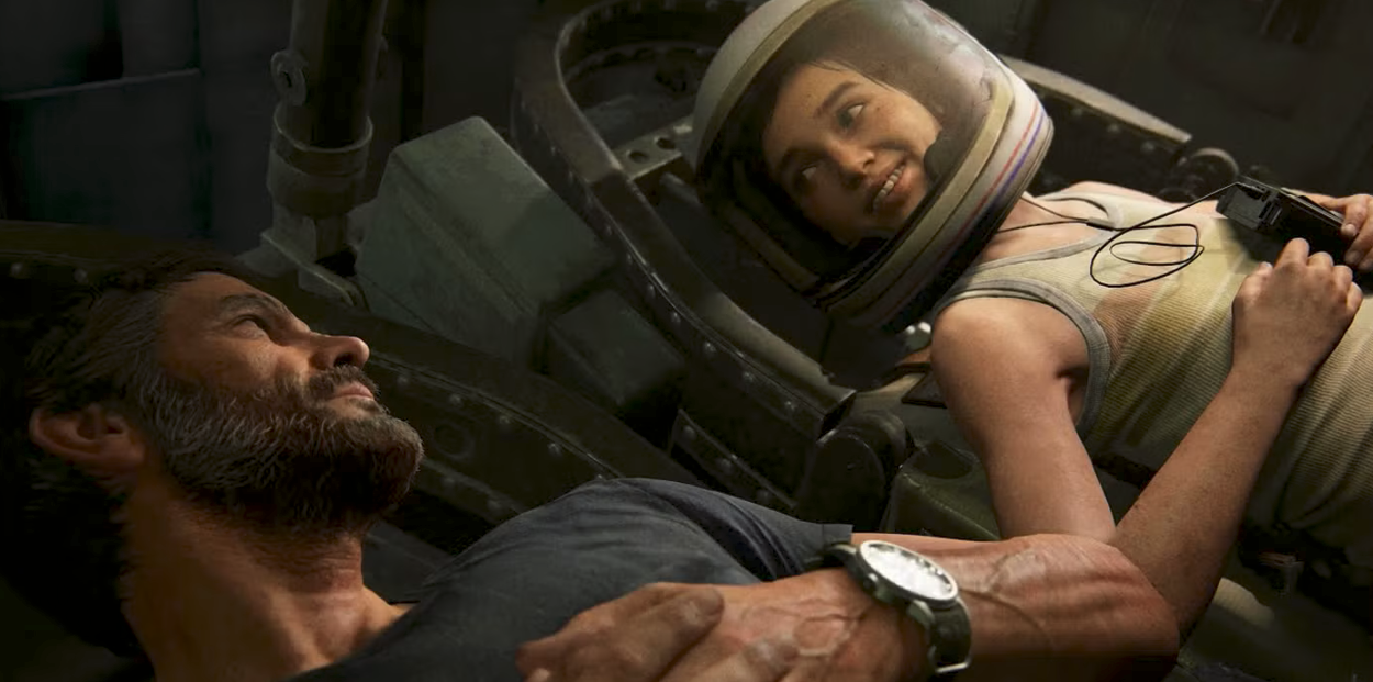 Joel on the left and Ellie on the right. They are lying inside a spaceship on display at an abandoned museum.