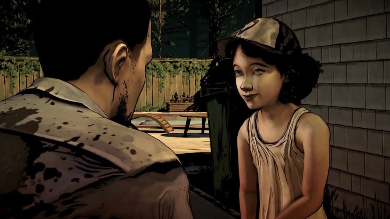 Lee Everett looking at Clementine, who is wearing her signature baseball hat.