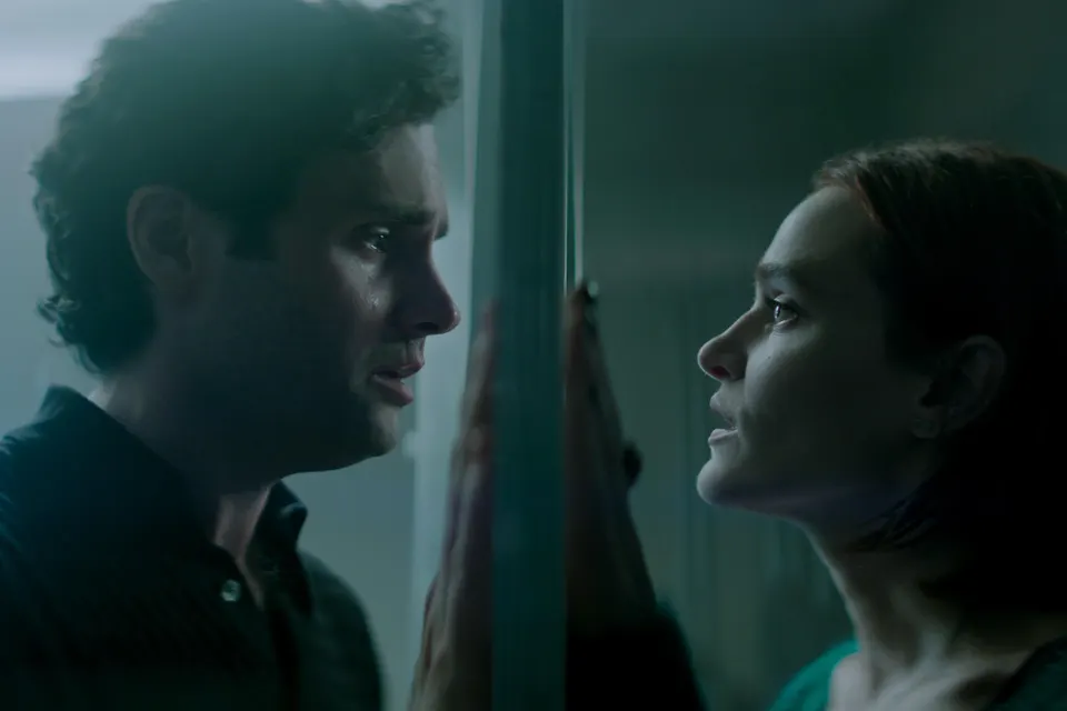 Joe and Bronte stare into each other's eyes. Berlanti, Greg & Gamble, Sera. You. 2018-2025.