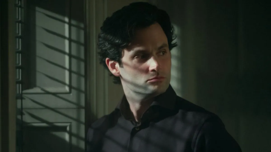 Joe looks away mysteriously. Berlanti, Berlanti, Greg & Gamble, Sera. You. 2018-2025.