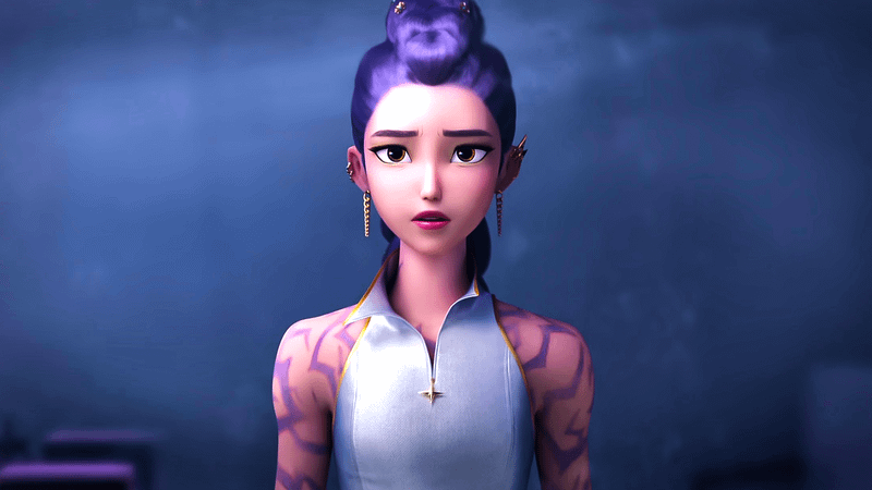 Rumi wearing a high neck vest that shows her bare arms, showing the purple patterns on her skin.