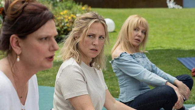 The women of Rage sit in a zen circle. 