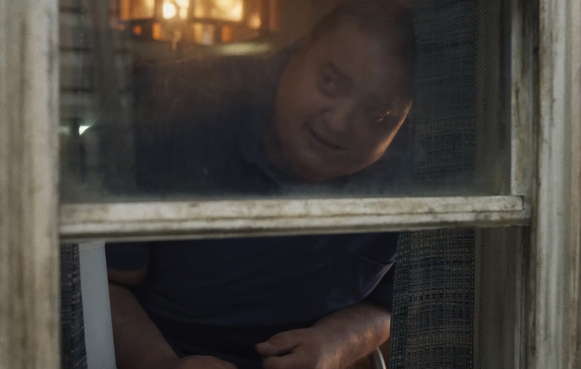Charlie looking out his window in 'The Whale.' Aronofsky, Darren. The Whale. 2022.