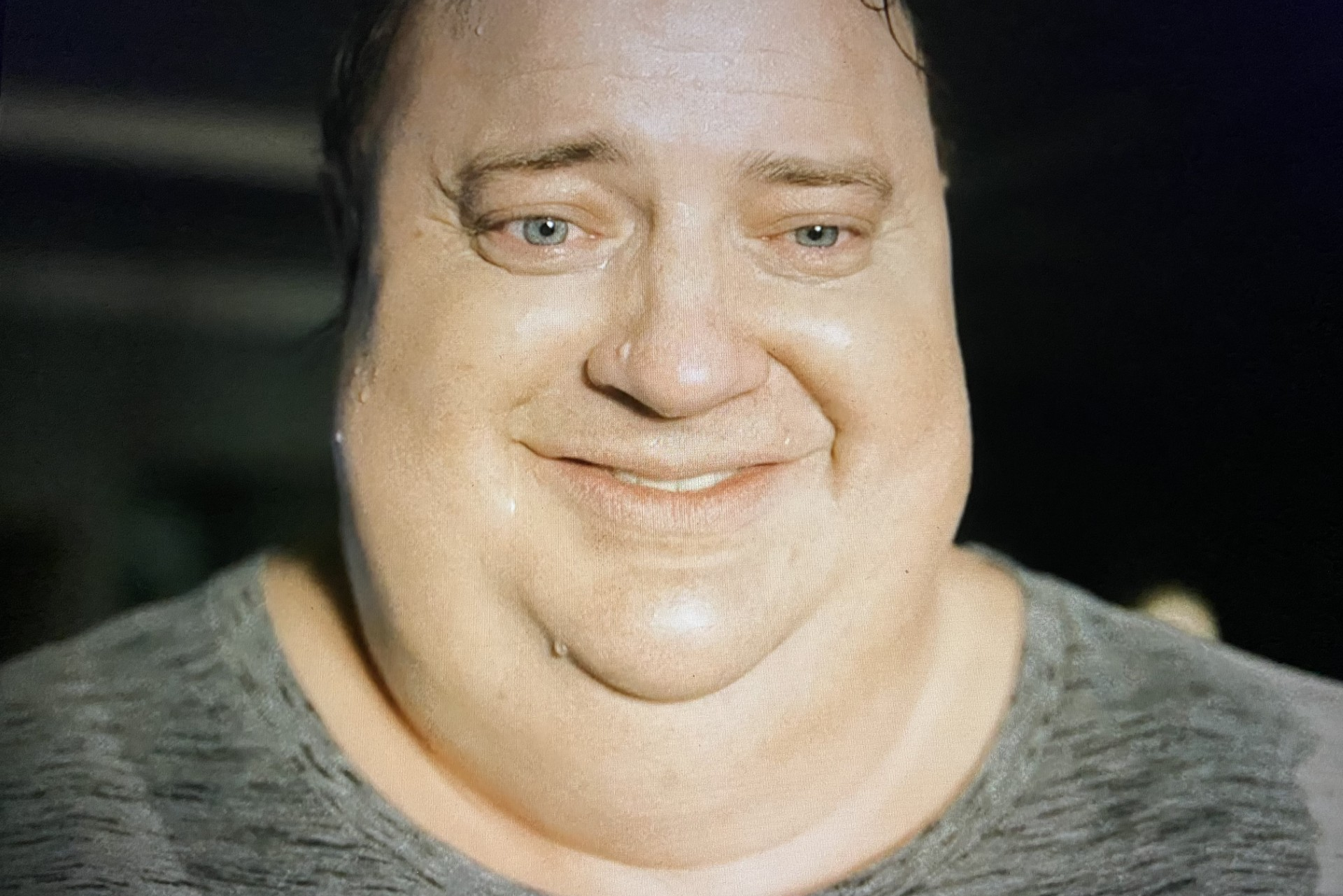 Charlie smiling in the ending scene of 'The Whale.' Aronofsky, Darren. The Whale. 2022.