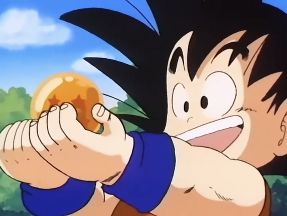Goku holds out his beloved 4 star ball.