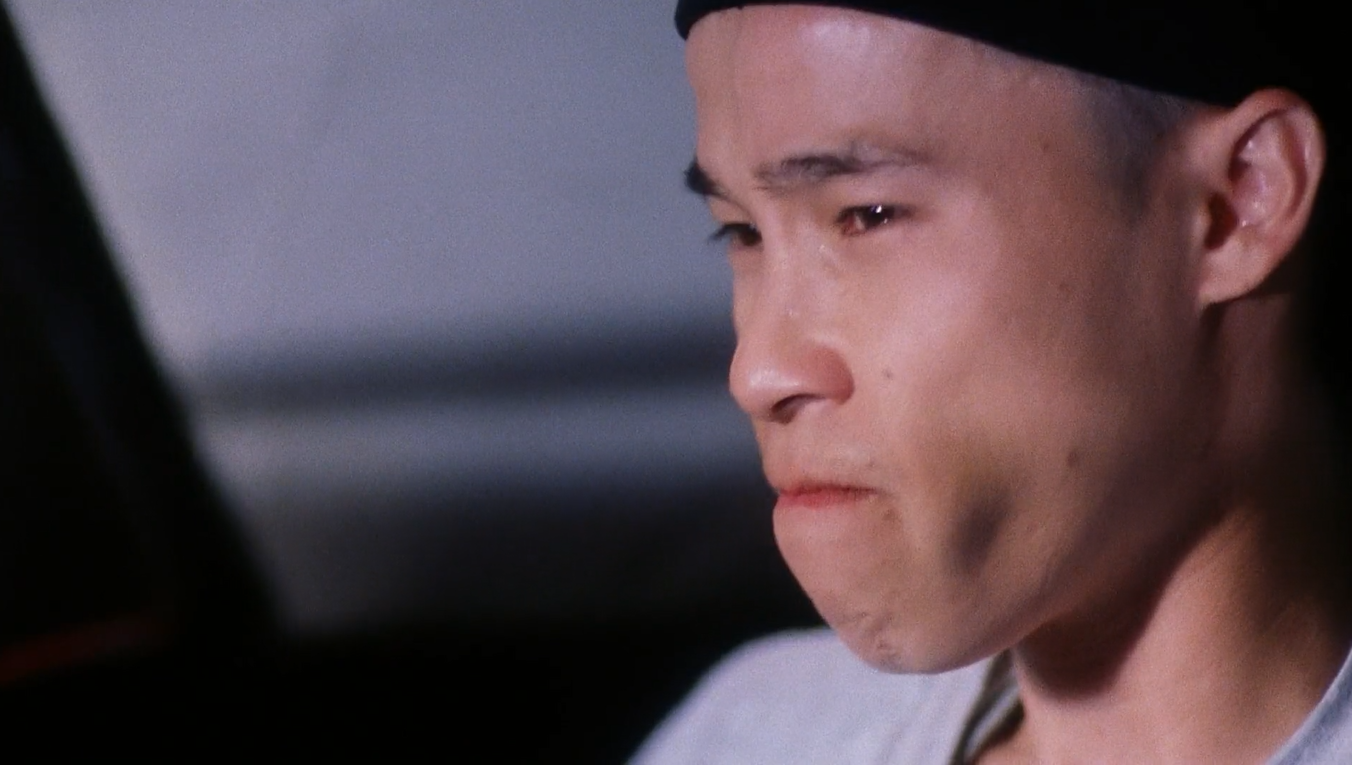 A close-up shot of Virgil, portrayed by Jason Tobin, as he struggles to hold back tears. 