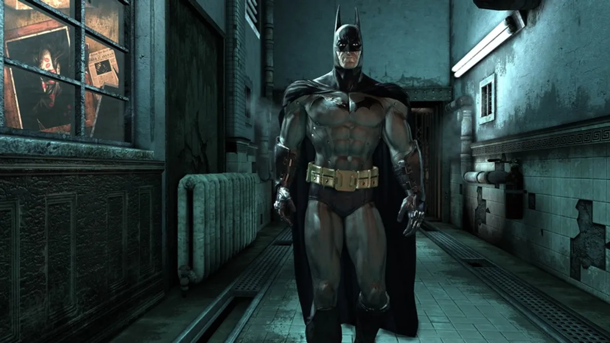 Batman walking down a corridor in Arkham Asylum.