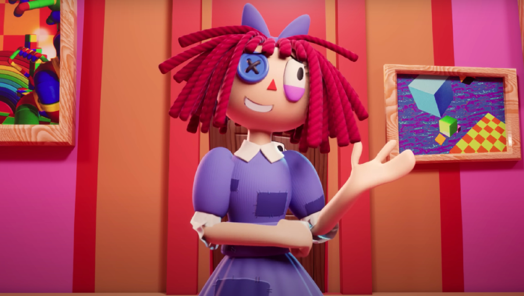 Ragatha gestures with a smile on her face. "Pilot." The Amazing Digital Circus. Episode 1, Glitch Productions, 13 October 2023, YouTube.