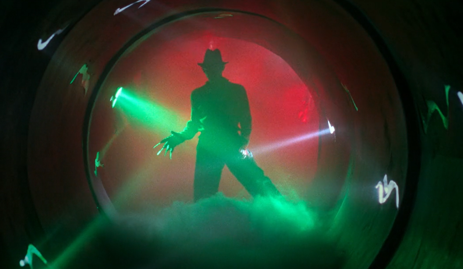 Freddy Krueger, played by Robert Englund, standing in silhouette.