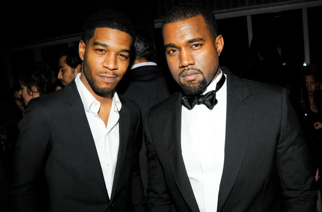Kid Cudi and Kanye West attend an event together.