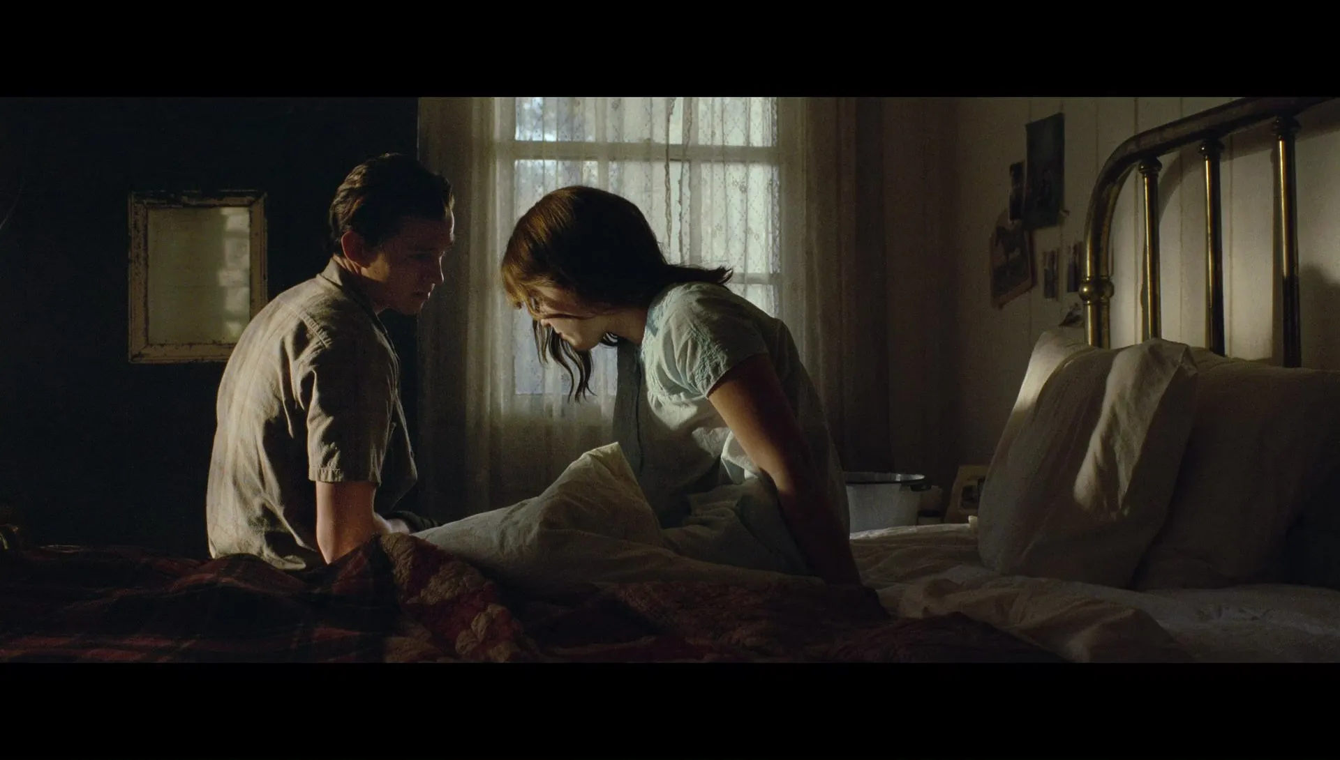 Arvin comforts a depressed Leonora. Campos, Antonio, Dir. The Devil All the Time. 2020.