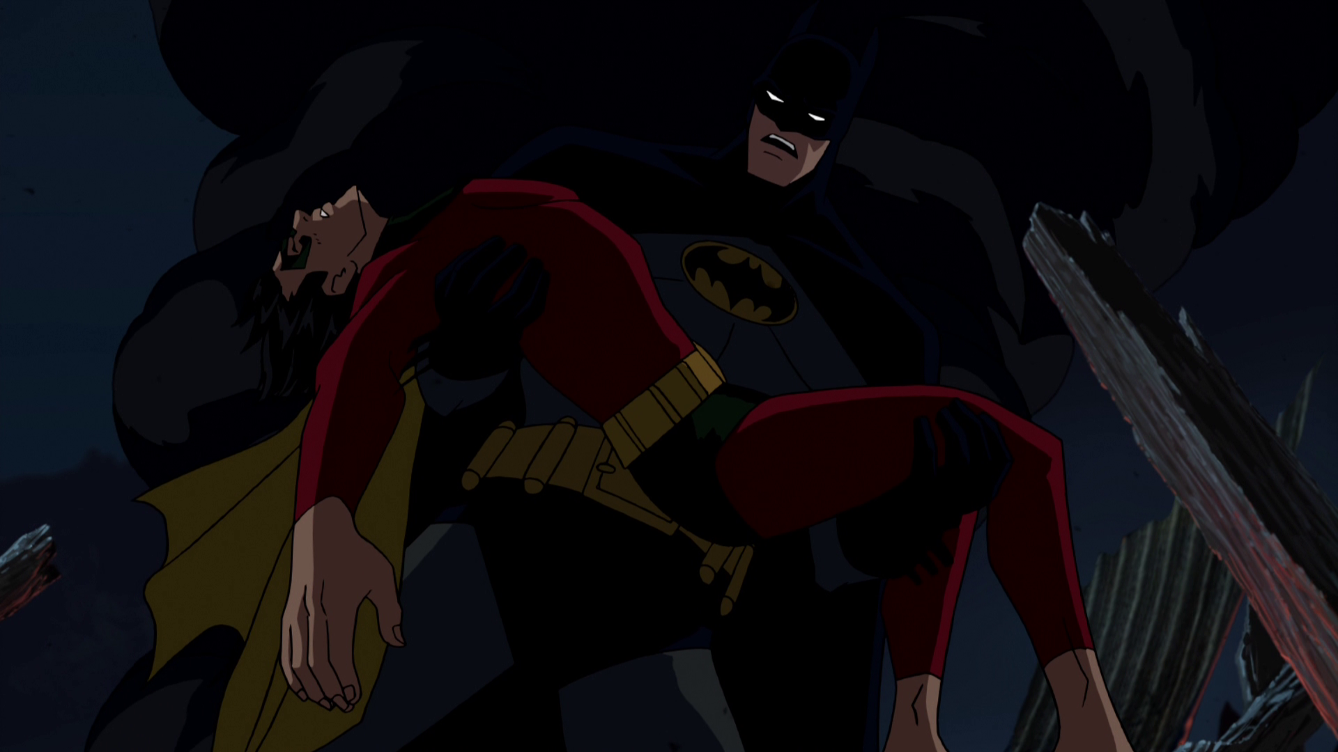 Batman lifts Robin's corpse from the rubble. Vietti, Brandon, dir. Batman: Under the Red Hood. DC Entertainment; Warner Bros. Animation; Warner Premiere, 2010.