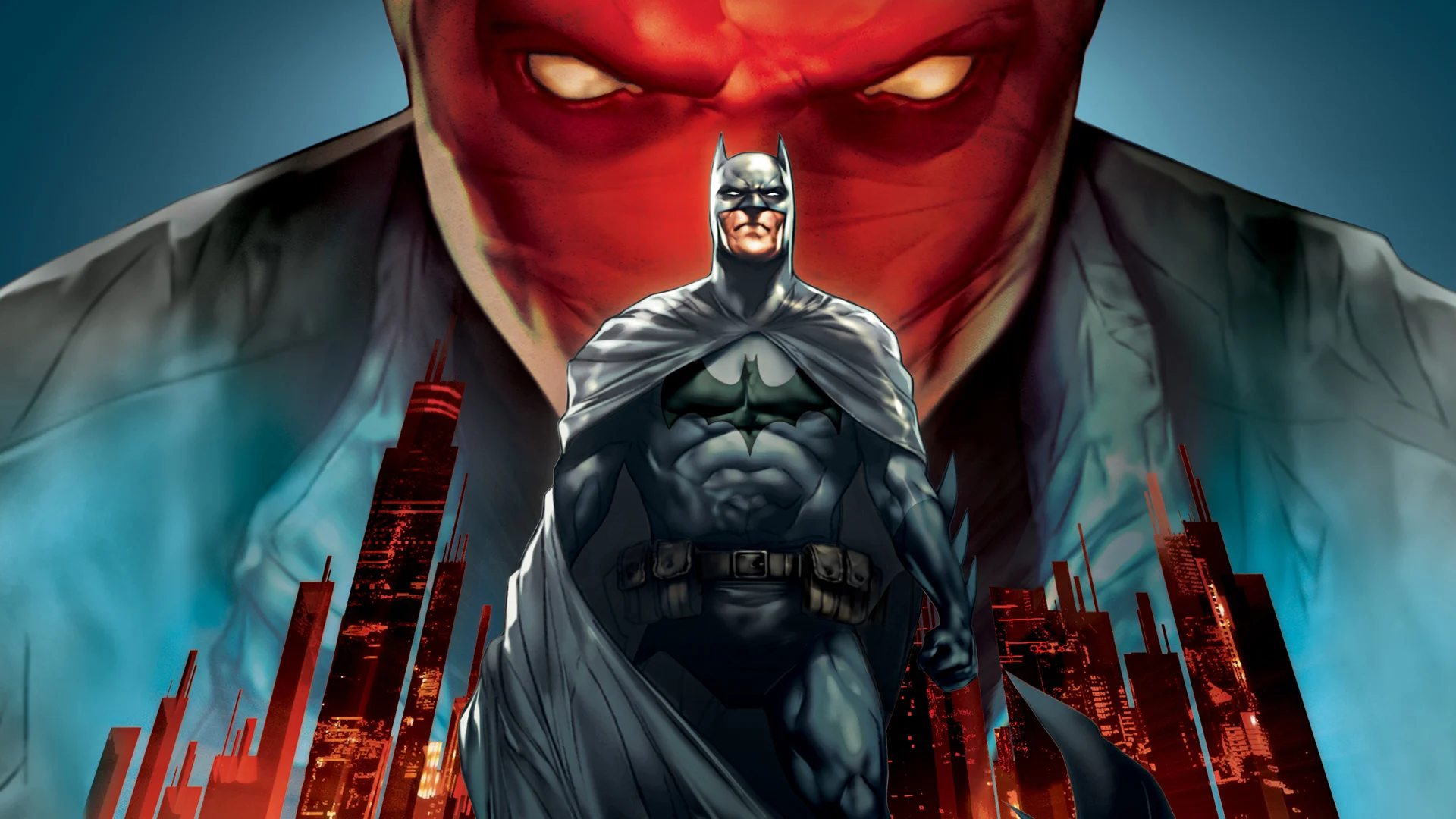 Batman stands as the image of the Red Hood looms over Gotham City.