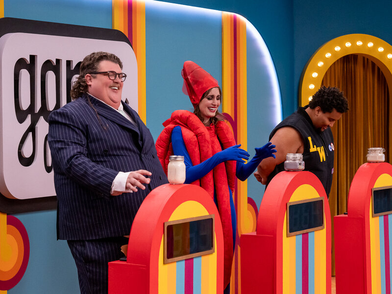 ”Game Changer” cast in flamboyant costumes. 