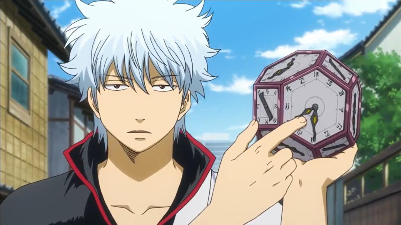 Gintoki holds a strange clock he found.