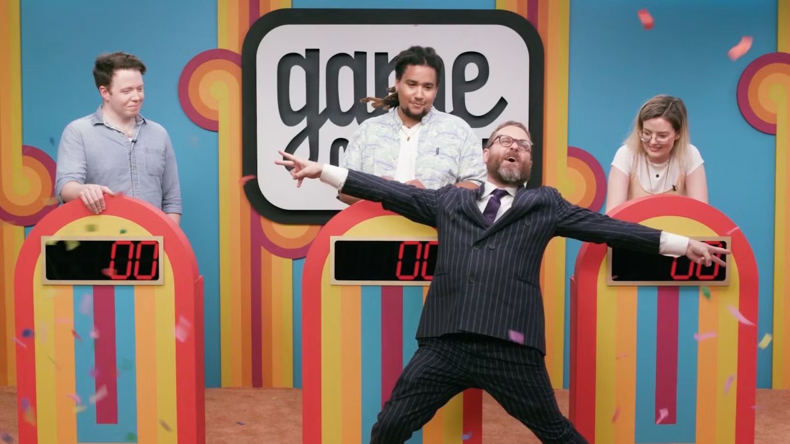 Dropout’s “Game Changer,” their Improv centric game show, promotional image of the cast reacting to Sam Reich. 