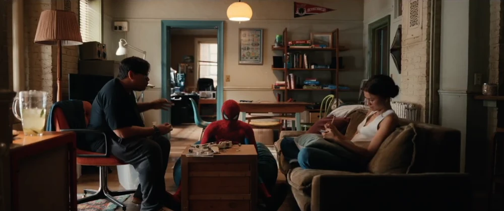 Spider-Man, Ned, and MJ hanging out together.