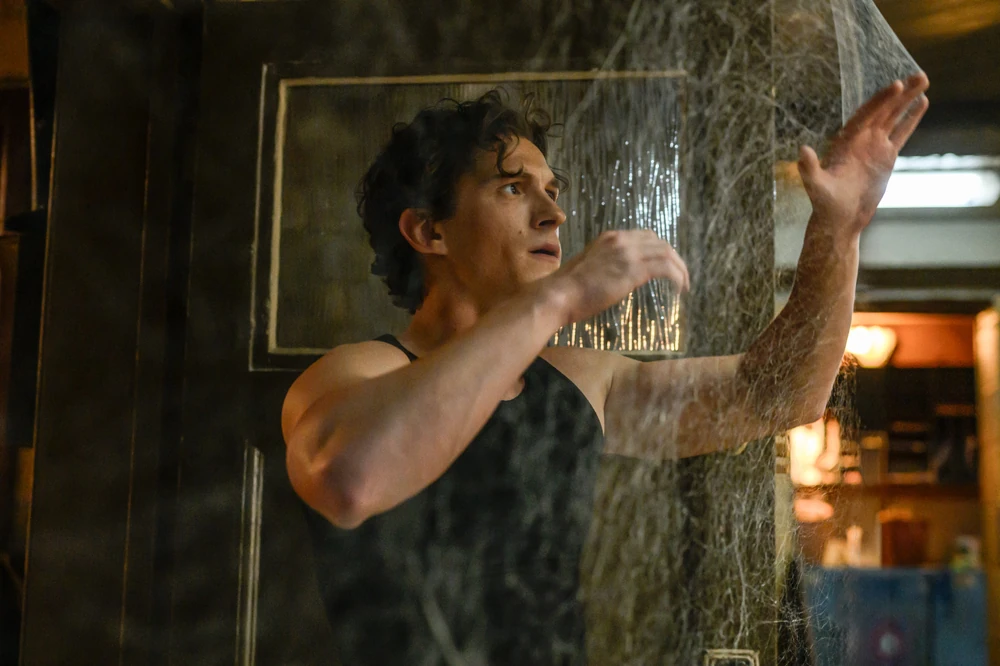 Peter shocked by all the spider webs in his apartment.