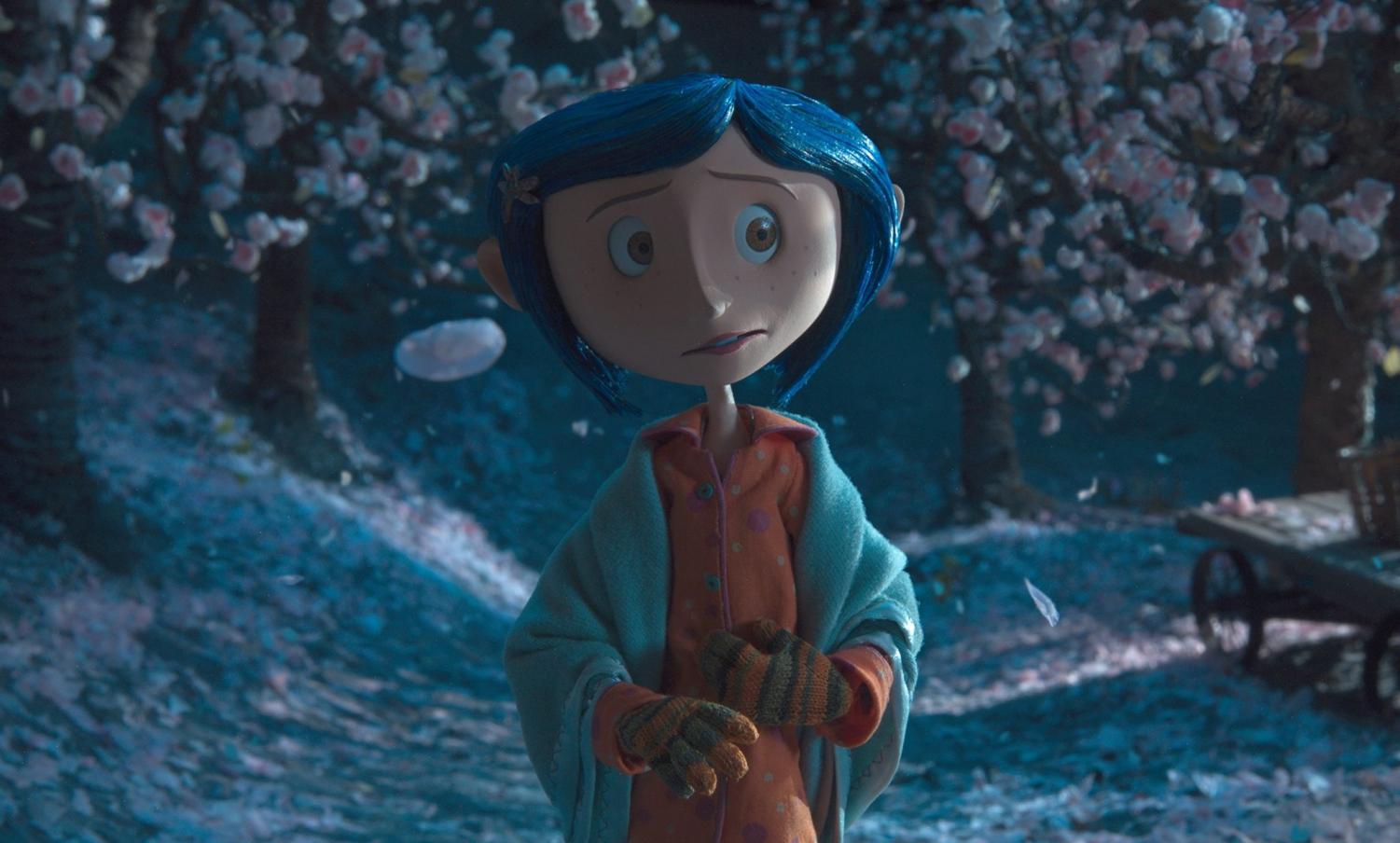 Coraline walking through the woods in the snow