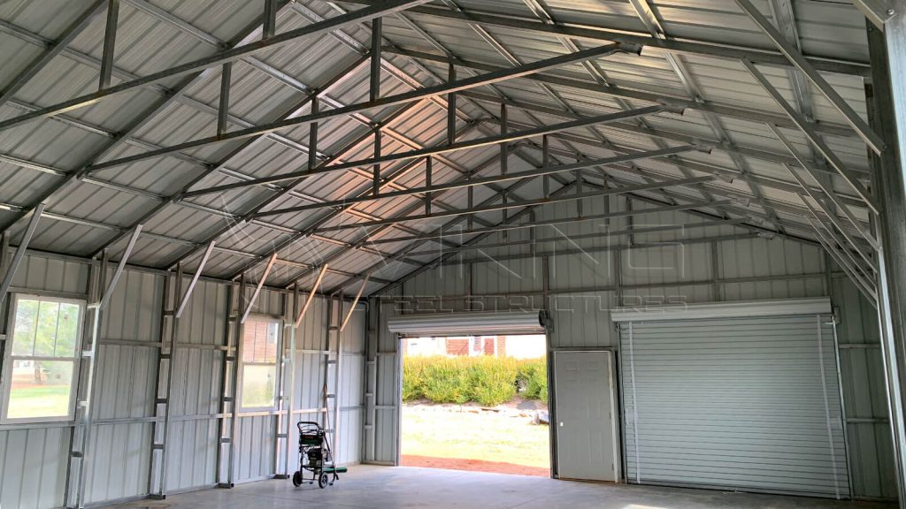 https://storage.googleapis.com/stateless-vikingsteelstructure/2022/11/30x40x10-all-vertical-modular-garage-inside-view-1024x576.jpg