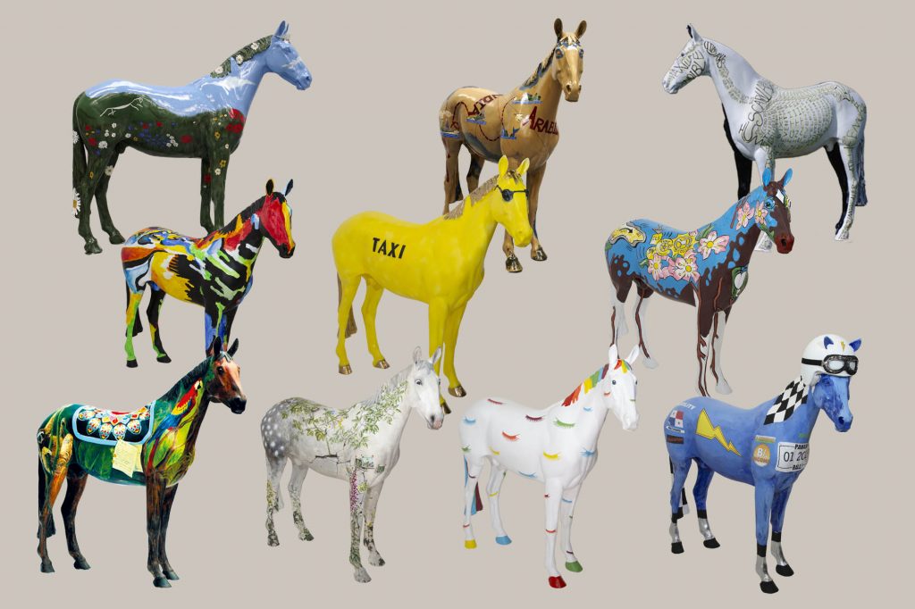 Ten colourful horse sculptures