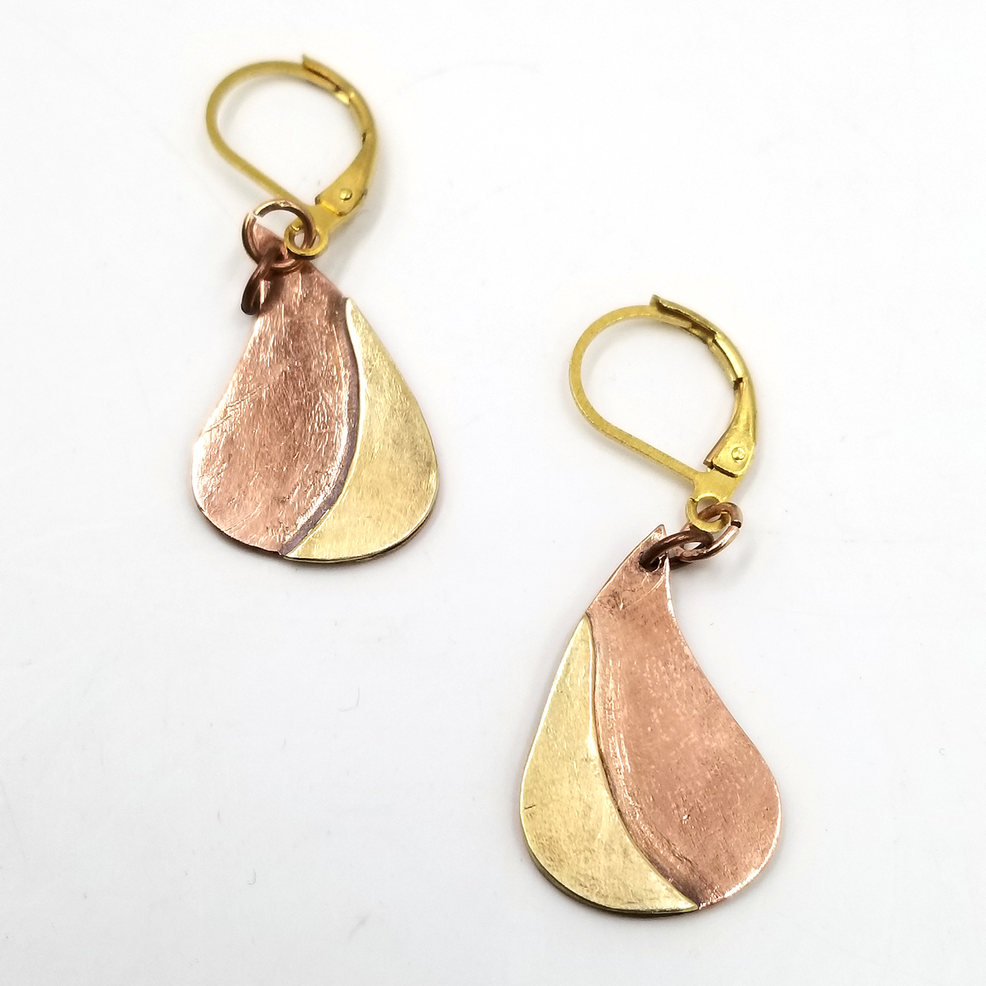 Two brass and copper teardrop shaped earrings