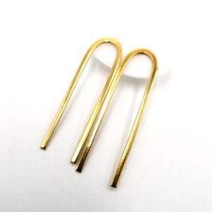 Two long arched brass earings