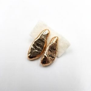 Two long copper nugget earrings