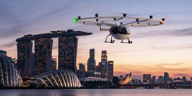 Volocopter,UAM,VoloCity Air Taxi,urban air mobility,eVTOL,transportation solutions,sustainable,efficient,battery-powered,zero emission,noise-canceling,testing,Paris Olympics,Osaka Expo,air taxi service,regulatory hurdles,infrastructure development,VoloDrone,VoloRegion,AAM